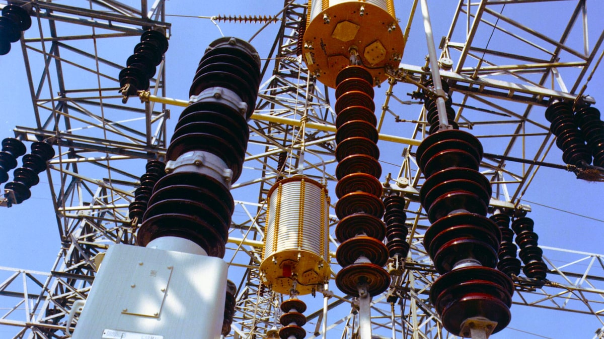 Electrical substation with high-voltage transformers, insulators, switchgear and overhead transmission equipment
