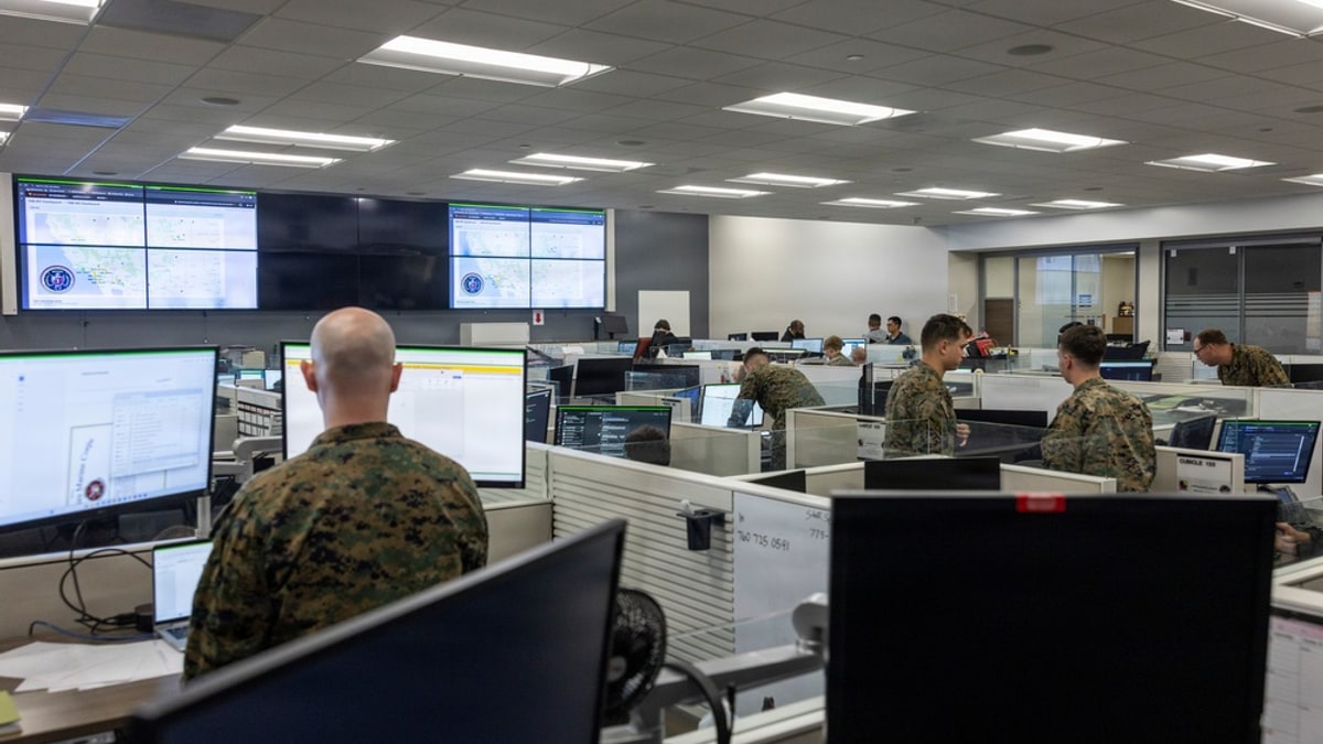U.S. Marines managing networks and cybersecurity in a network and security operations center