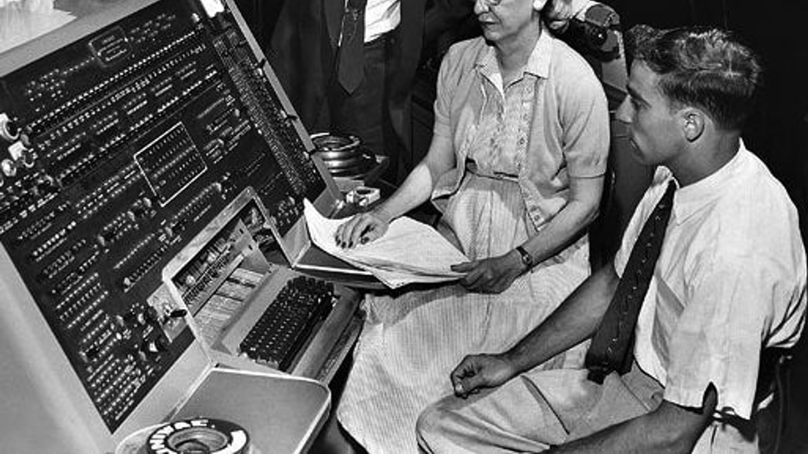 Grace Hopper with members of Remington Rand's Automatic Programming Department at a UNIVAC keyboard