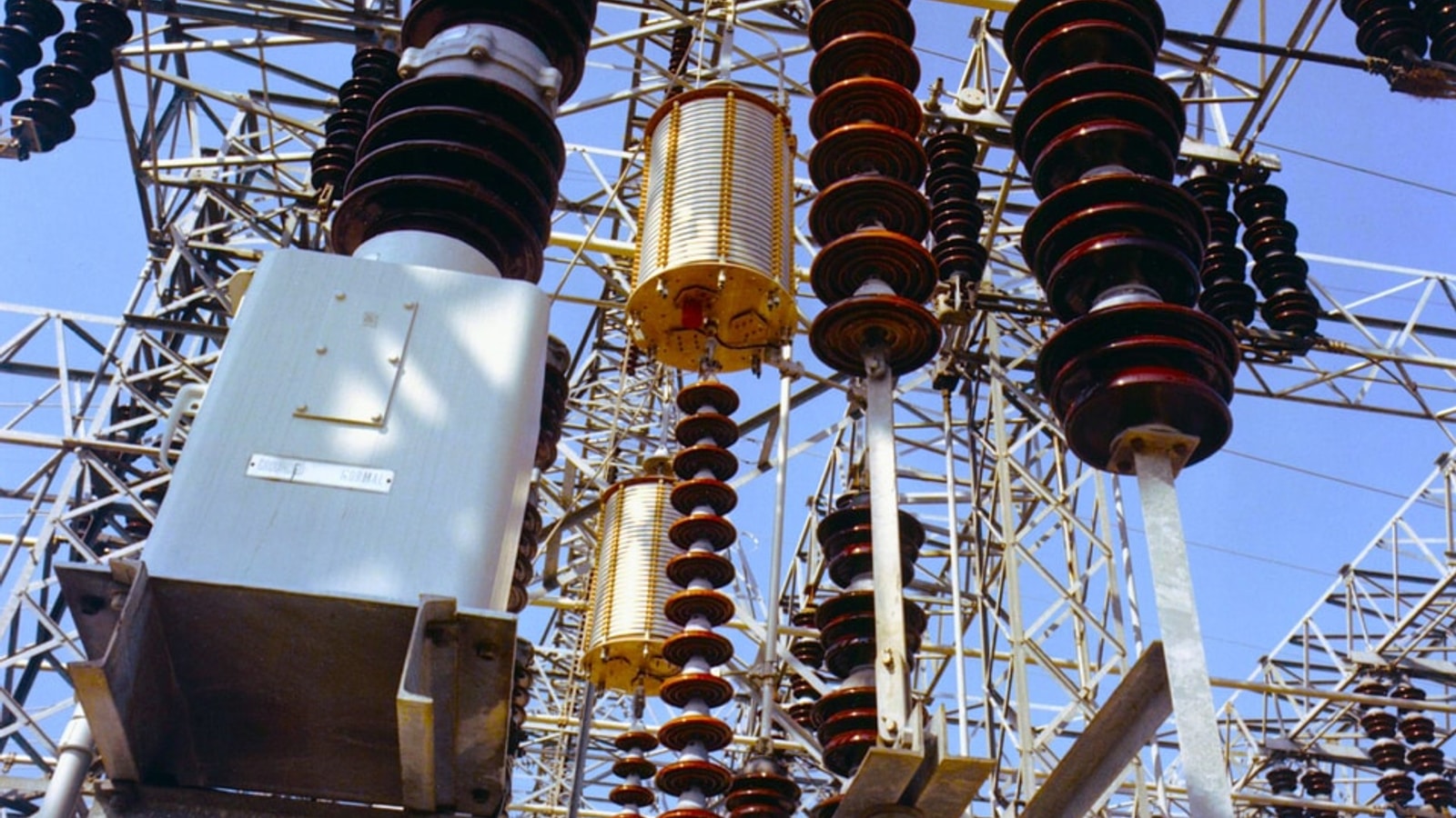 Electrical substation with high-voltage transformers, insulators, switchgear and overhead transmission equipment