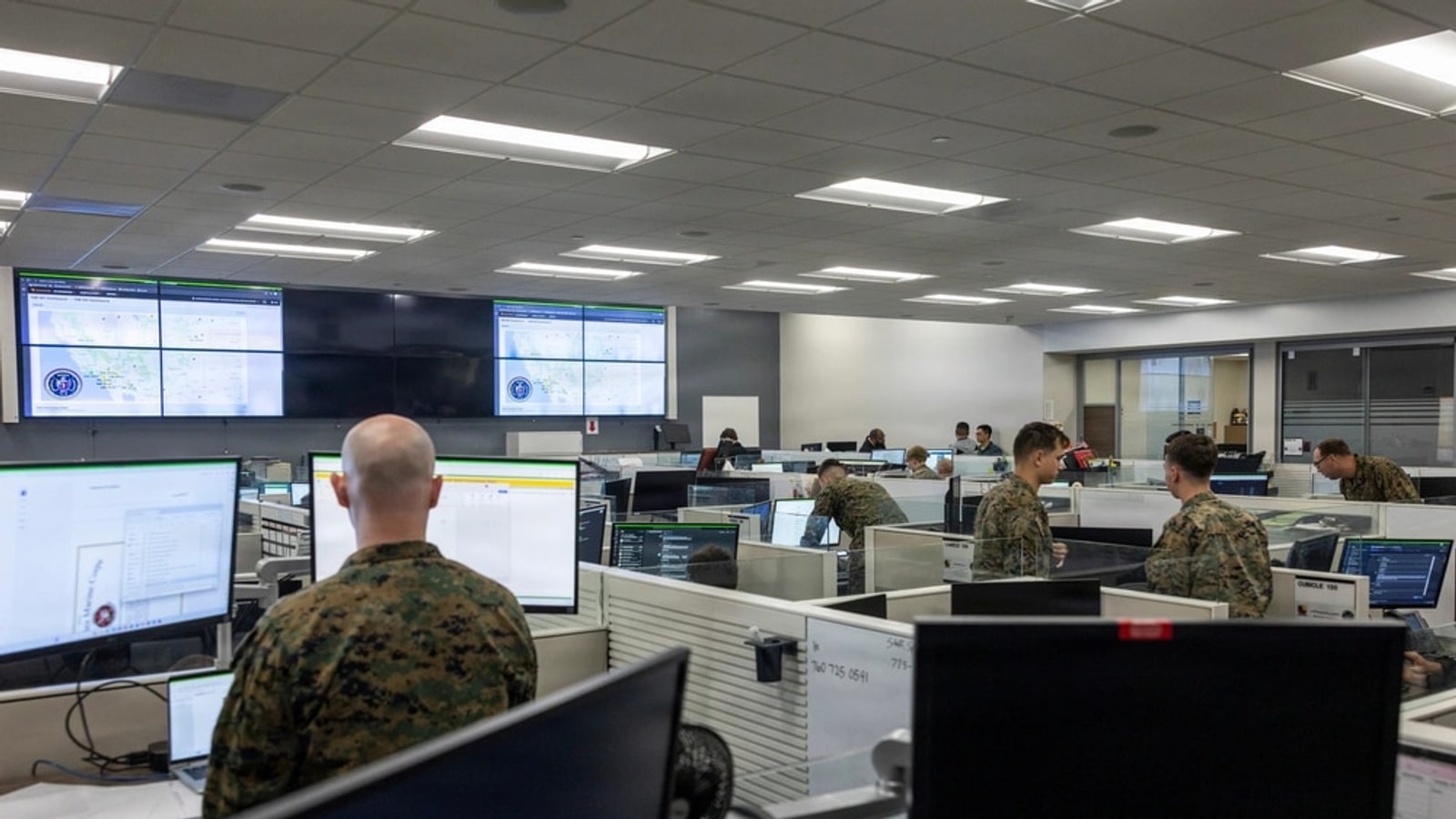 U.S. Marines managing networks and cybersecurity in a network and security operations center