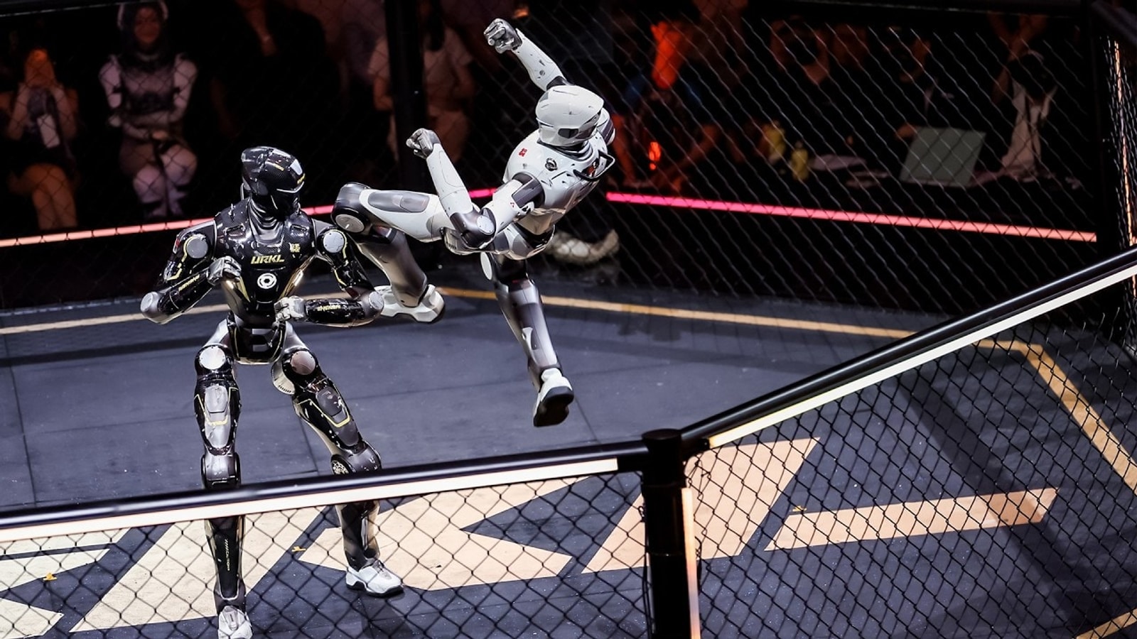 Broadcast view of an EngineAI URKL humanoid robot fighting event