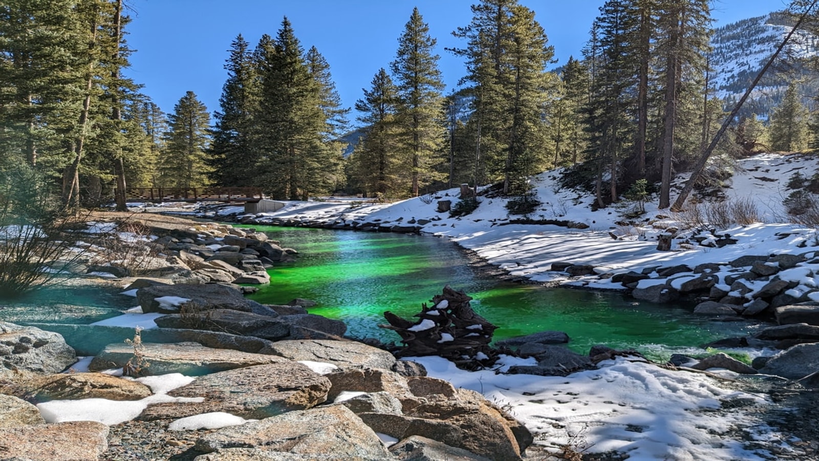 Fluorescent tracer dye moving through river water during a USGS dye-tracing study