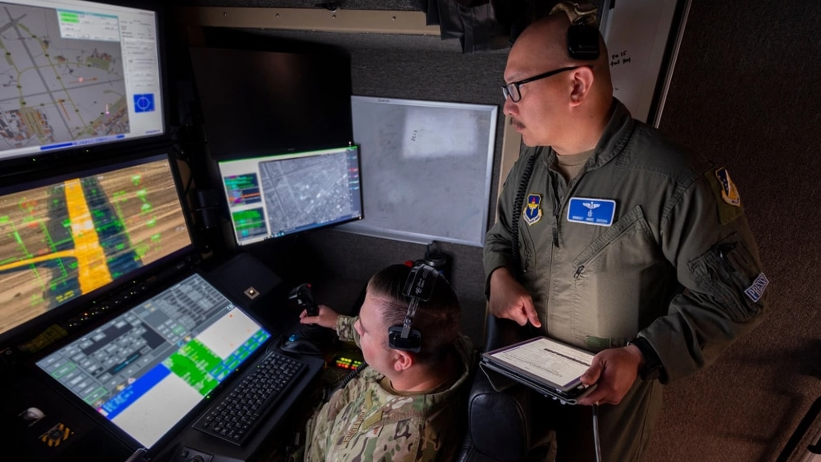 Air Force sensor operators working at a control station
