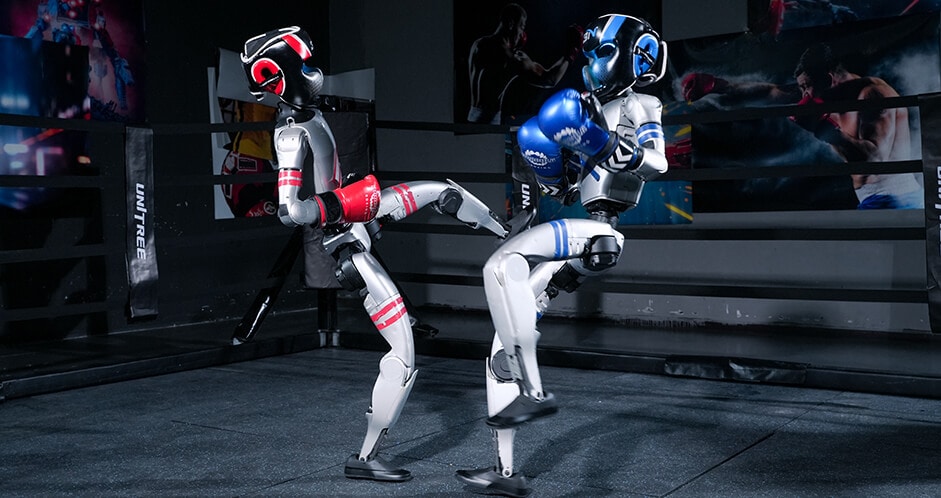 Two Unitree G1 humanoid robots performing a kick exchange in a ring