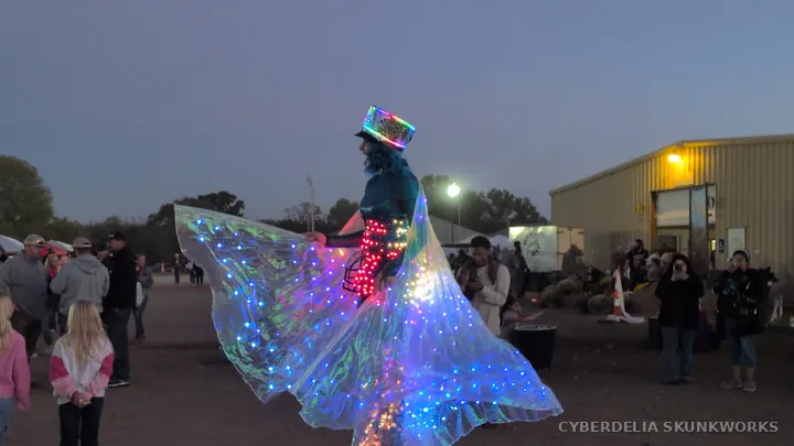 LED costume lights spread into a fan of color at dusk.