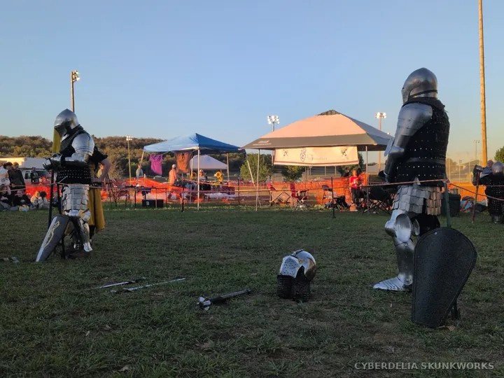 Armored combatants face one another in the demonstration area.