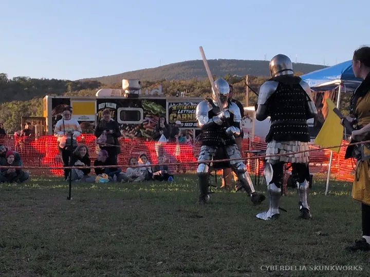 Armored fighters reset their distance during the demonstration.