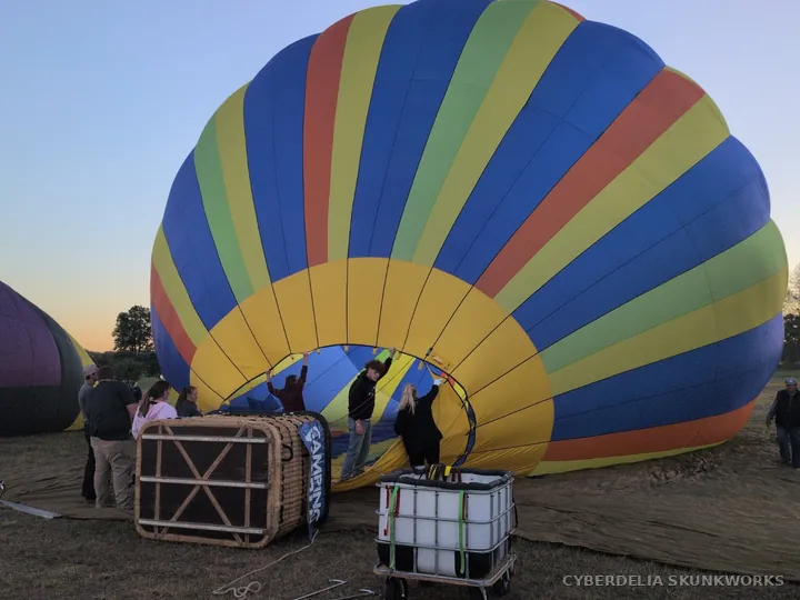 A striped envelope fills beside its basket and crew.